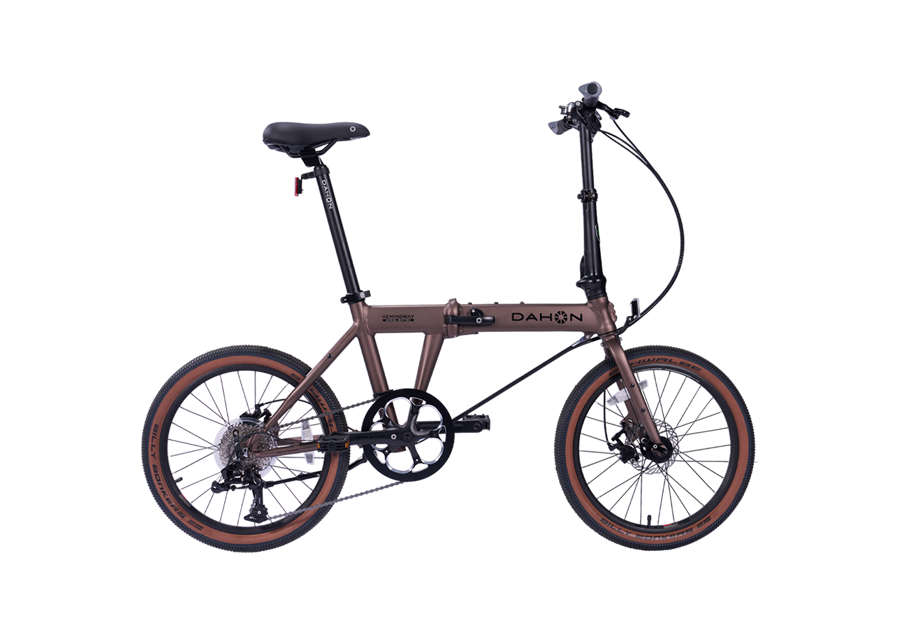 Hemingway GR Dahon folding bike in rust metallic, suitable for city and park trails.