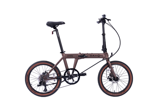 Hemingway GR Dahon folding bike in rust metallic, suitable for city and park trails.