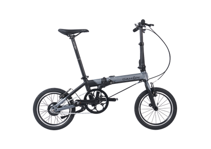 Slate grey Dahon K-Feather electric folding bike with minimalist design for city trips.